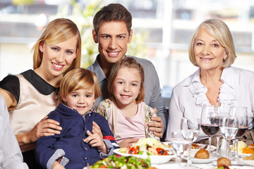 Happy family at lunch table