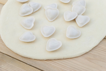Fototapeta na wymiar Dumplings in a heart shape dough.
