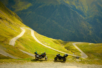 Landscape with mountain road and two motorbikes