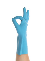 Blue glove on hand shows sign ok.