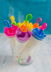 Ice cream in colored forms in a glass