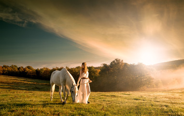 Beautiful sensual women with white horse