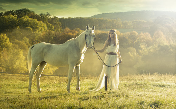 Beautiful sensual women with white horse