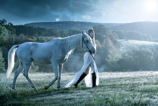 Beautiful sensual women with white horse