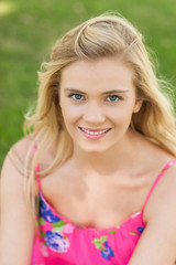 Fototapeta premium Joyful young woman smiling at camera
