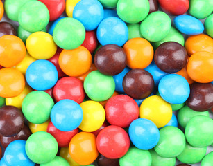 Fototapeta na wymiar Chocolate drops with bright colored candy coating