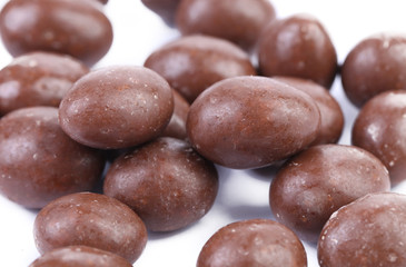 Dark brown dragee in chocolate covered