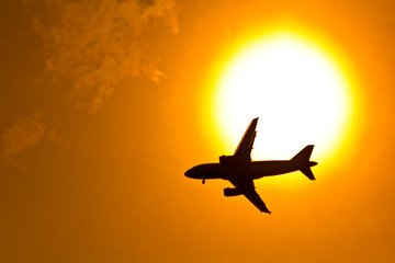 Fototapeta na wymiar Aircraft in the sunset