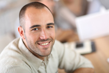 Young man attending business school project