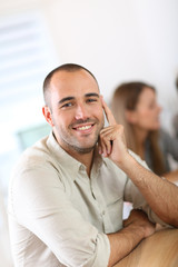 Young man attending business school project