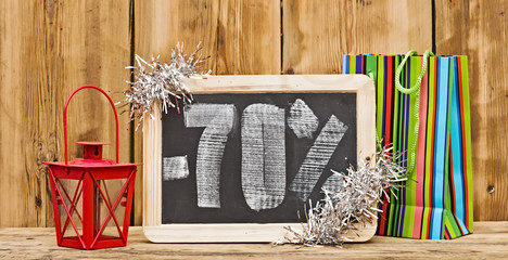 seventy percent discount written on blackboard with christmas de