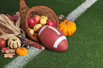 College style Football with a cornucopia on grass field
