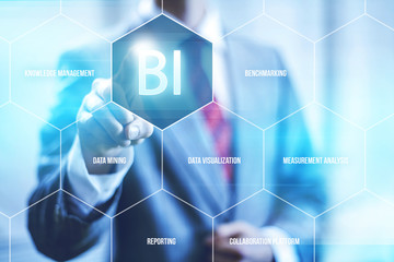 Business intelligence concept man pressing selecting BI - obrazy, fototapety, plakaty
