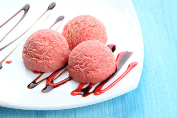 Delicious ice cream on plate on table close-up