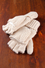 Fototapeta na wymiar Wool fingerless gloves, on wooden background