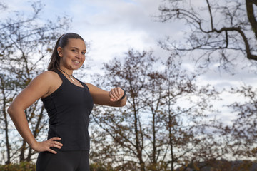 Runner woman checking  time and pulse rate
