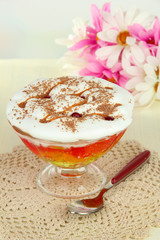 Tasty jelly in bowl on table on light background
