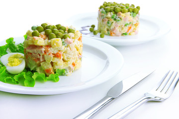 Russian traditional salad Olivier, isolated on white