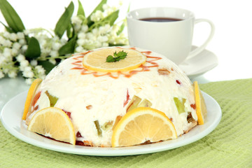 Delicious jelly cake on table on white background