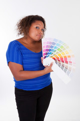 African American woman holding a color palette - Black people