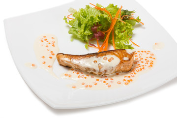 Grilled salmon in a creamy caviar sauce.