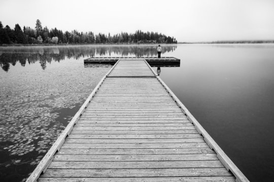 B&W of child on dock.