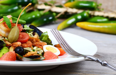 Salad with seafood with a squid, a tuna fillet, meat of mussels