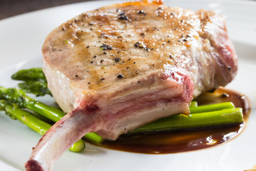 Grilled pork chop with asparagus