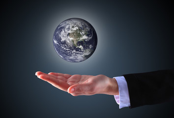 business hand holding globe(Collage images