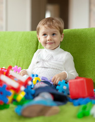 3 years child plays with toys