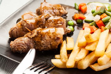 Beef rolls and vegetables