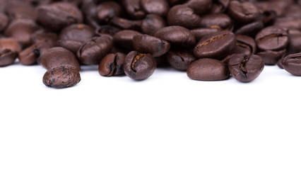 Brown coffee beans isolated on white background