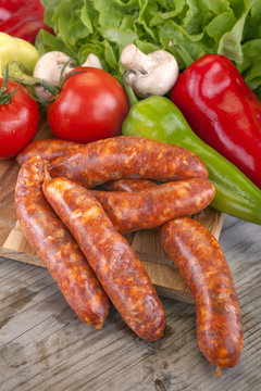 sausage with vegetables and salad