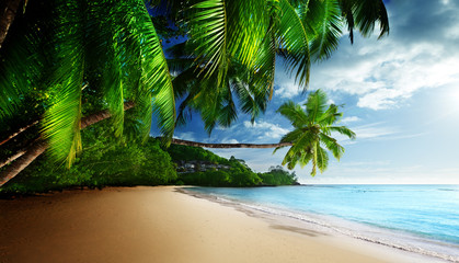 sunset on beach Anse Takamaka of Mahe island, seychelles - obrazy, fototapety, plakaty