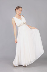 Fototapeta na wymiar elegant girl in white dress