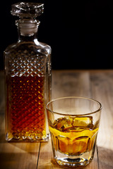 glass and bottle of whiskey