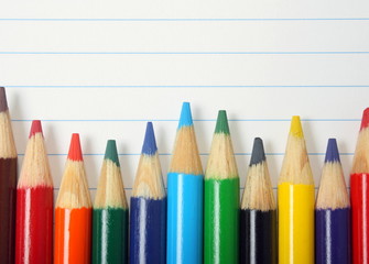 Fototapeta premium Coloured Drawing Pencils on Lined Paper