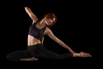 Fototapeta na wymiar beautiful yoga posing on black background