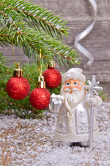 Santa Claus under the Christmas tree branches
