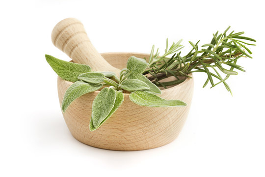 mortar and pestle with sage and rosemary