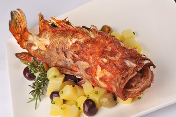 Roasted scorpion fish with baked potatoes