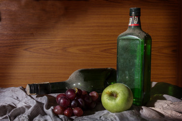 Antique wine bottle with fruits