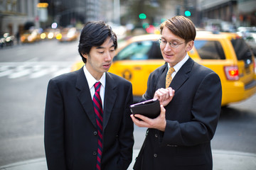 Asian and caucasian businessman in New York City