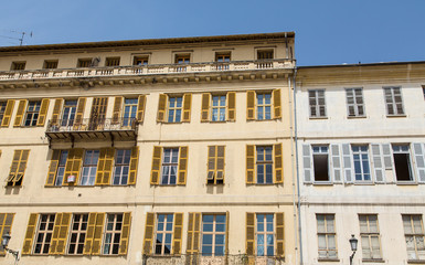Fototapeta na wymiar Old Hotel in Nice with Yellow Shutters
