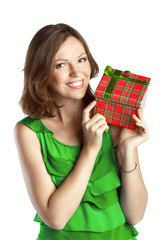 Young smiling woman in green dress with a gift box
