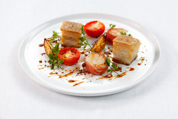 Fototapeta na wymiar Sliced roast pork belly on a plate .