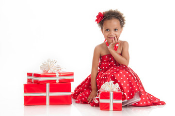 Little beautiful girl with gifts.