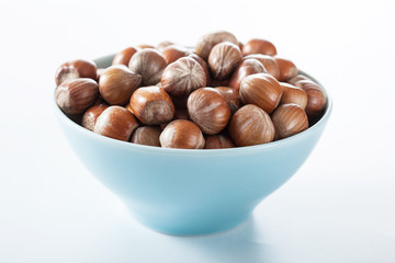 hazelnuts in blue bowl