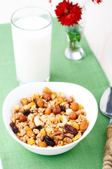 Healthy muesli breakfast with huts and raisin