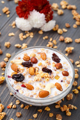Healthy muesli breakfast with huts and raisin